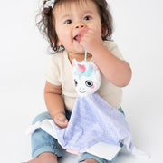 Toddler using the BooginHead Plush PaciPal Teether Blanket, Dreamer the Unicorn. Keeps track of pacifier with attaching loop. Super soft fabric from a woman owned small business. Easy to clean!